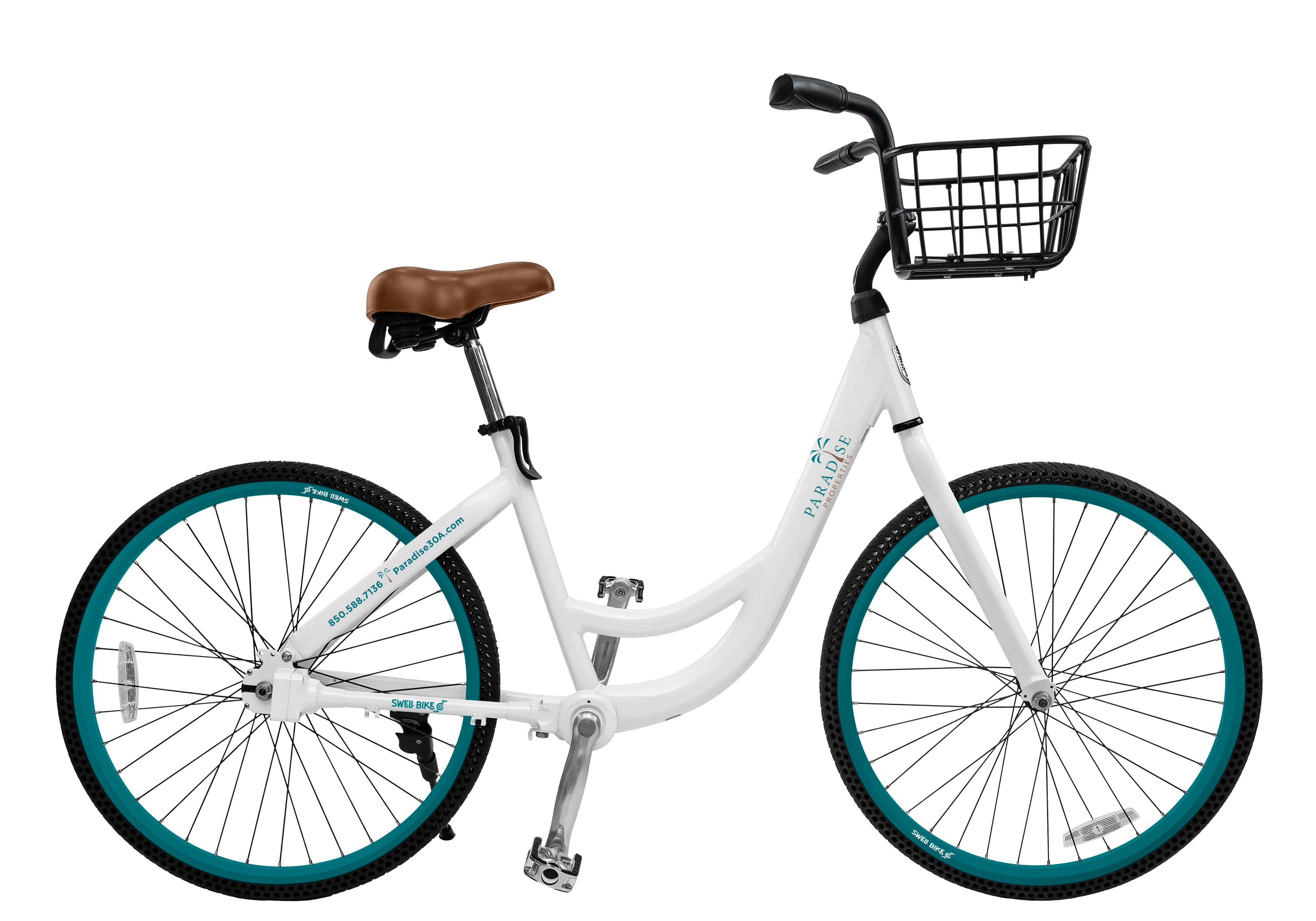 A custom white Swell bike with teal rims, a brown saddle and a front basket